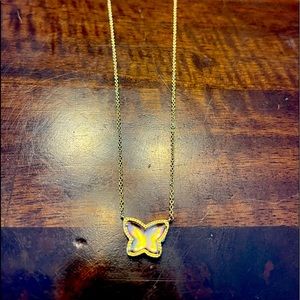 Kendra Scott Lillia Butterfly Gold Dichroic Glass necklace with a pink tint